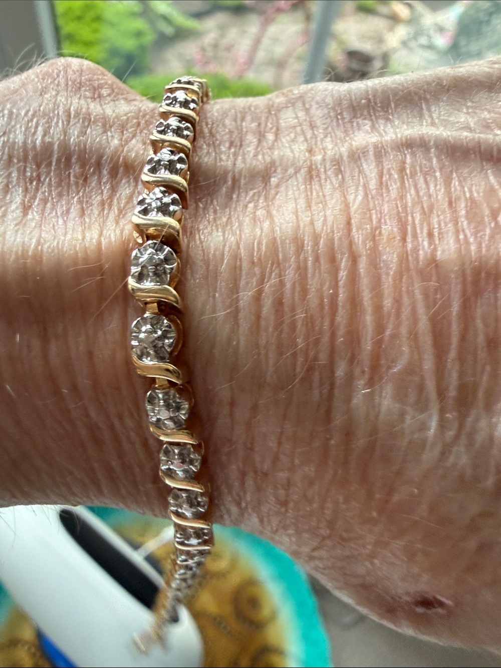 Gold-plated sterling silverTennis Bracelet with Clear Rhinestones. Gorgeous.